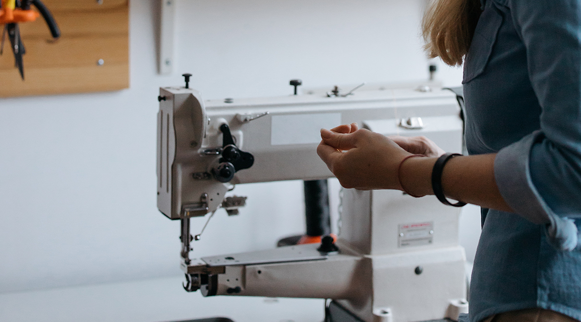 Layna repairing a sewing machine